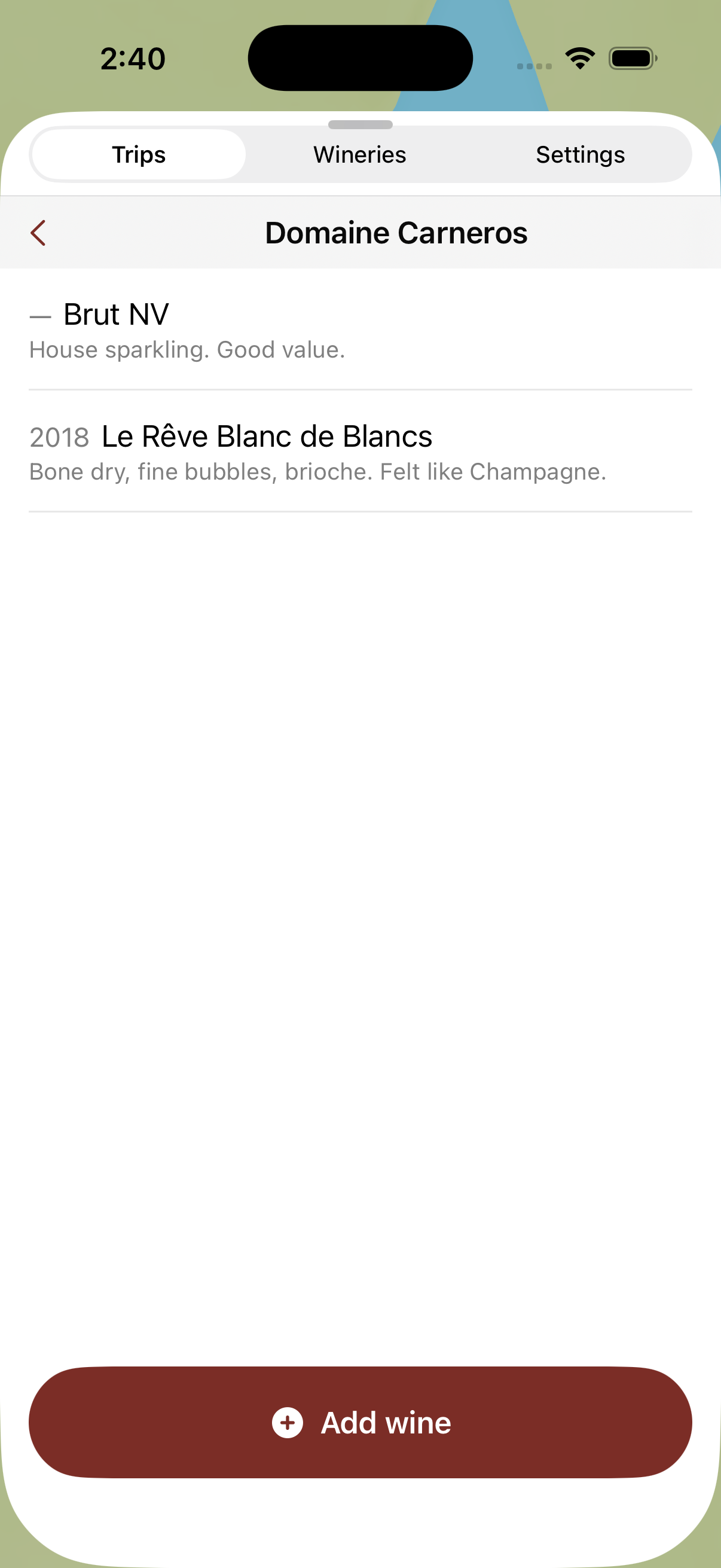 The Domaine Carneros tasting screen in Vine Trails listing Brut NV noted as house sparkling and good value, and a 2018 Le Reve Blanc de Blancs noted as bone dry with fine bubbles and brioche, above an Add wine button.